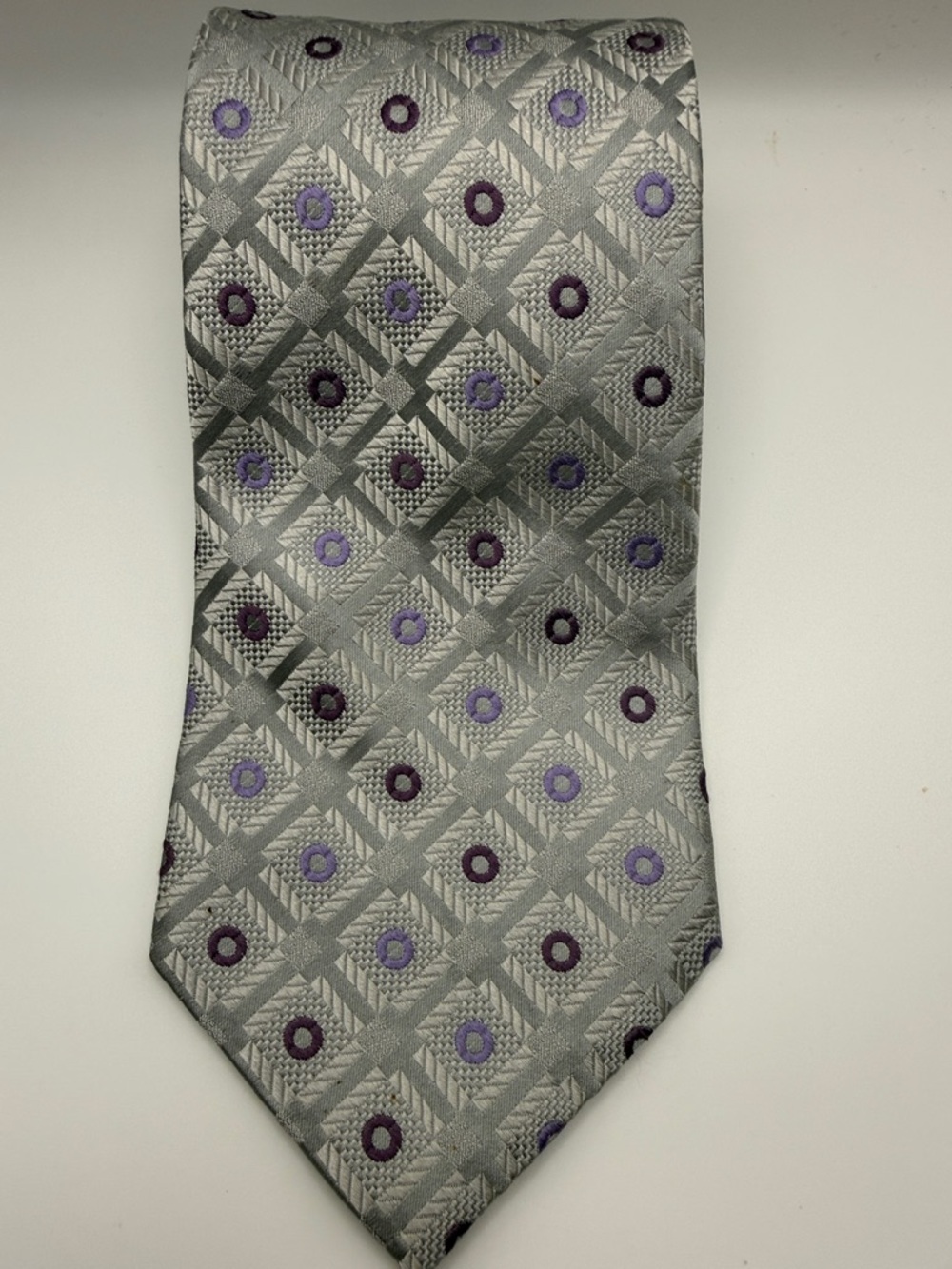 Pierre Cardin tie in a silver and purple geometric pattern. 100% silk.